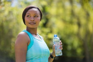 Woman Holding a Water Bottle