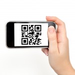 Young Woman Holding a Phone with a QR Code