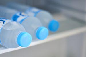 Labelled Bottled Water in a fridge